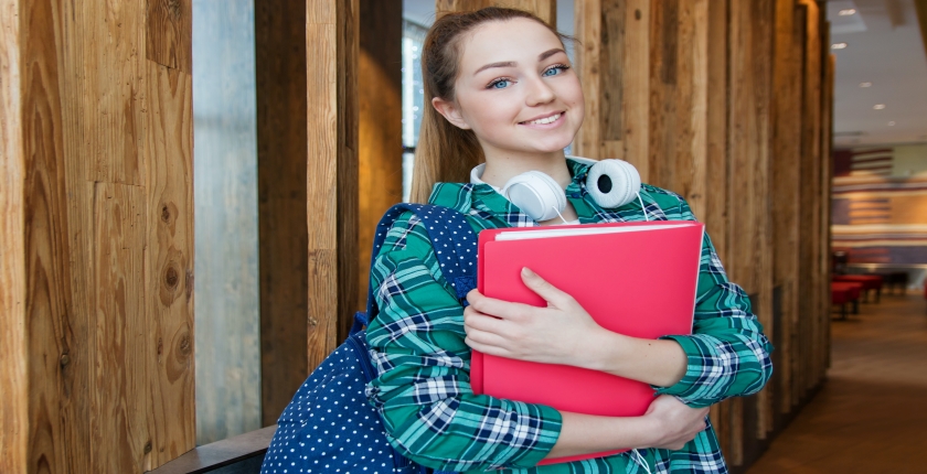 Student holding back pack