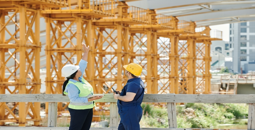 construction workers discussing a project onsite