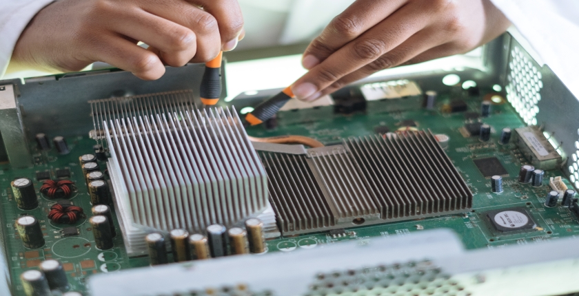 computer circuit board being repaired